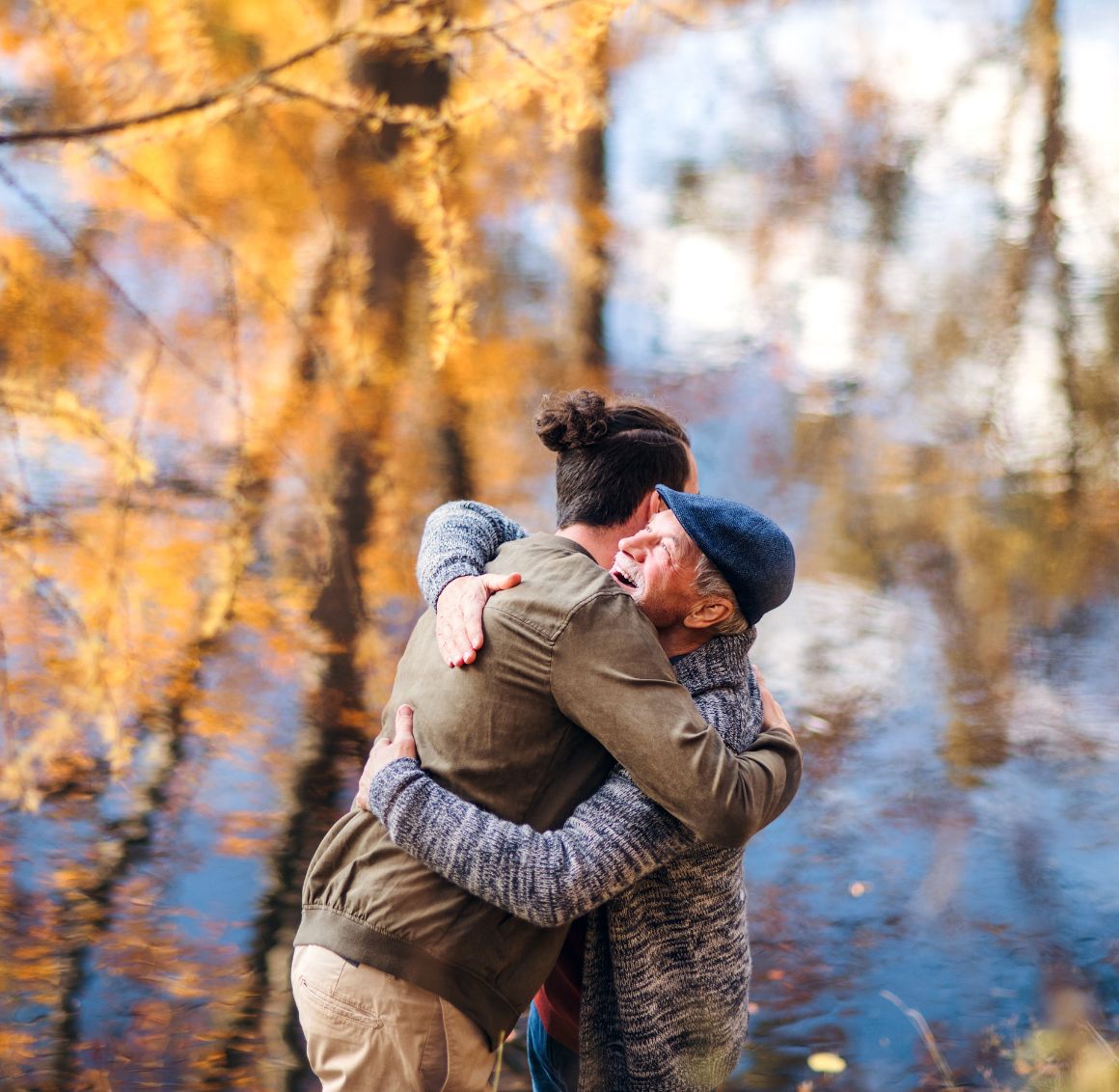 elderly hugging caregiver