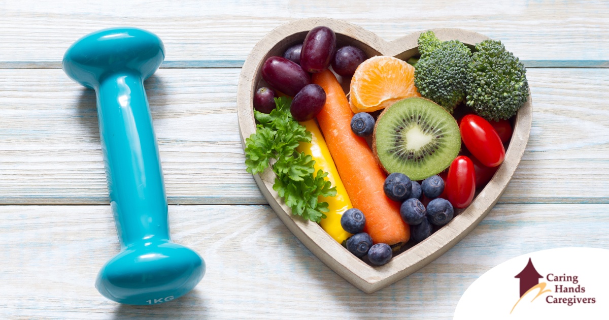 A heart with nutritious food and a dumbbell represents the healthy lifestyle that National Cholesterol Education Month promotes.