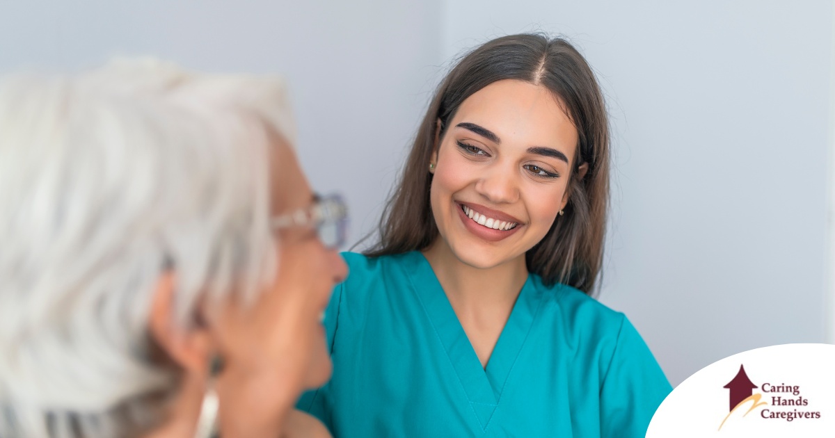 A caregiver smiles with an older client showing the results of successfully starting a new caregiving job.