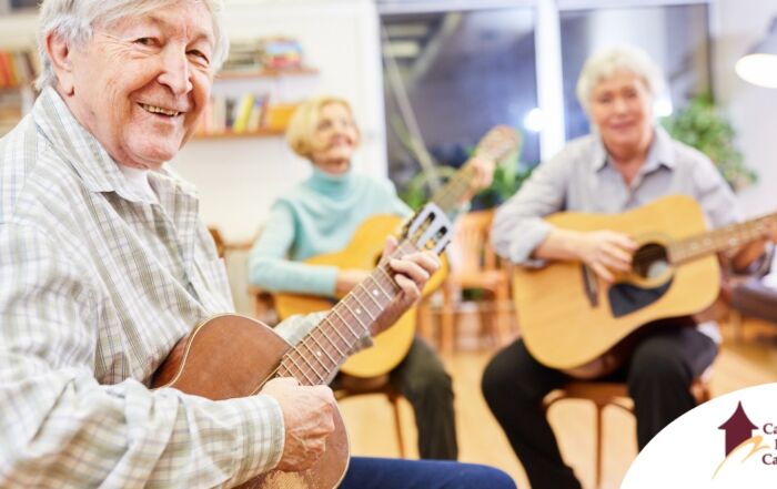 A group of seniors enjoy playing instruments together showing the impact of music for older adults.