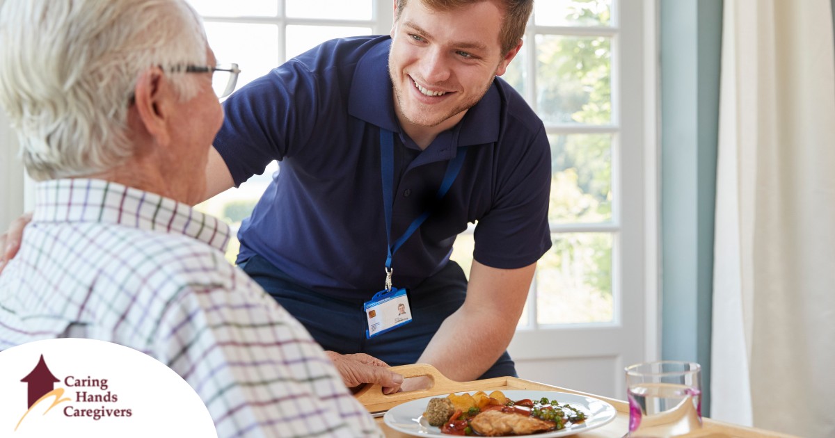 Professional caregiving involves helping clients with iADLs and ADLs as demonstrated by this caregiver helping a client by bringing a meal.