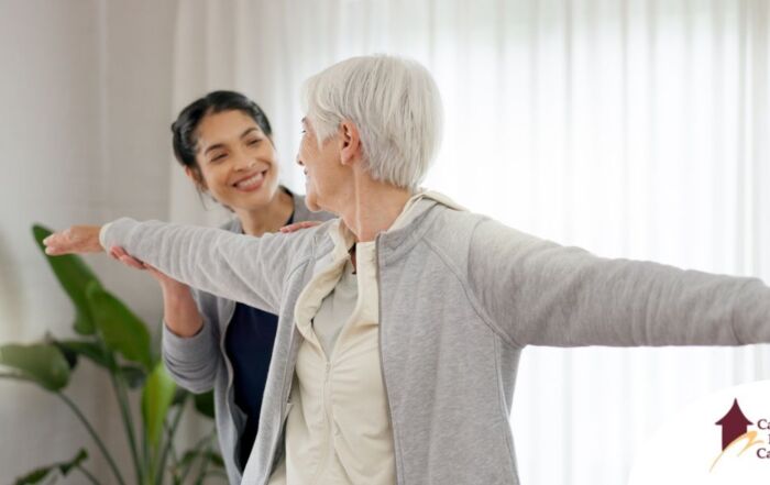 A caregiver and senior practice tai chi as one of many enriching activities for seniors at home.