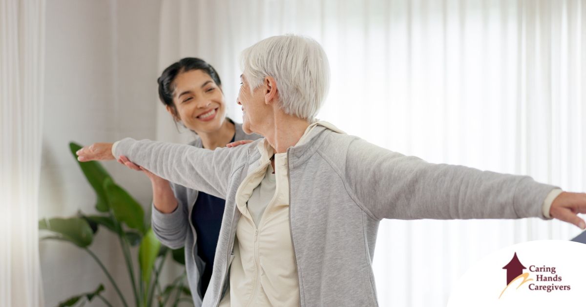 A caregiver and senior practice tai chi as one of many enriching activities for seniors at home.