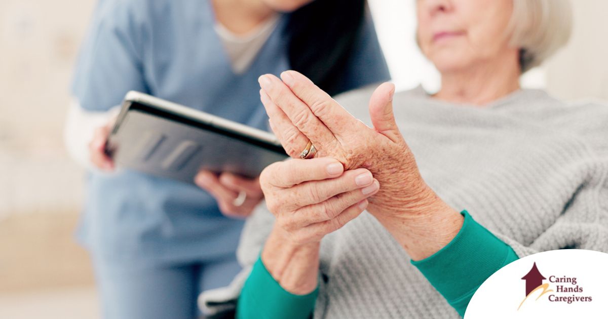 A caregiver provides in home care services to a senior with arthritis