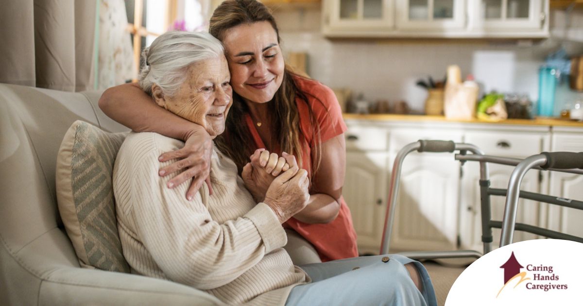 Caregiver supporting an elderly woman in the transition to senior home care
