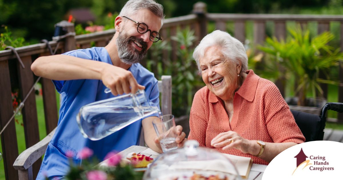 Summer Caregiving Tips for Keeping Clients Active in Warm Weather A caregiver applies summer Caregiving Tips including helping a senior stay hydrated.