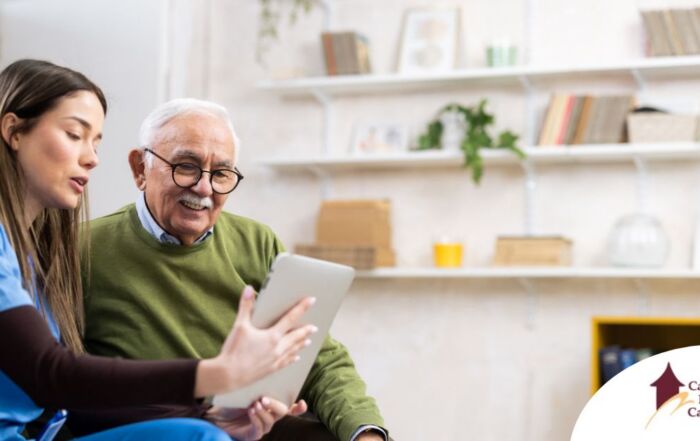 Home caregiver assisting senior man to use telehealth and senior care