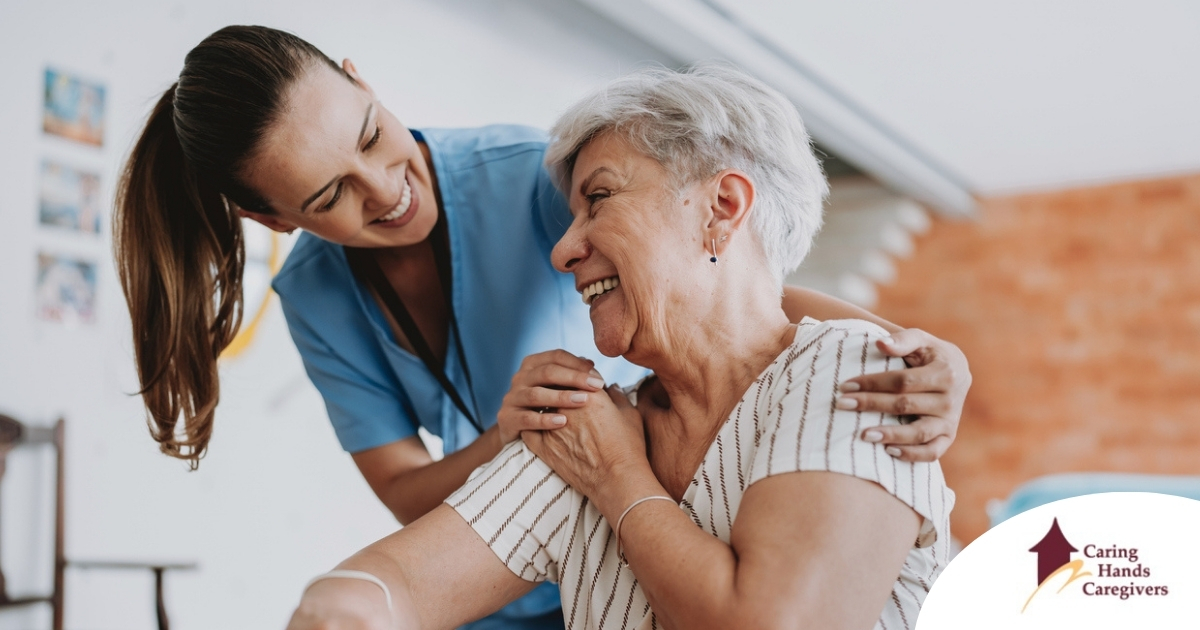 A female caregiver helping an older woman with stroke recovery at home A female caregiver helping an older woman with stroke recovery at home.